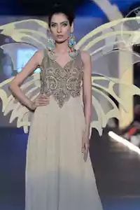 Step into the spotlight with the Ivory White Designer Wear Party Gown, the epitome of Pakistani elegance. This breathtaking maxi dress commands attention with its sophisticated sweetheart neckline and sleeveless silhouette, offering a perfect blend of grace and modern style. The exquisite two-tone detailing on the pristine ivory and white canvas adds a layer of luxurious depth, making every movement a statement. Designed for long-lasting impressions, this long-length masterpiece is tailored for those special evenings where you are destined to shine. Discover the perfect fusion of traditional craftsmanship and contemporary glamour, exclusively at Deemas Fashion.