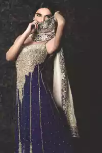 Royal Blue back trail maxi has been adorned with a long embroidered neckline and borders on the hemline. Three large motifs are implemented at the bottom before embellished borders on this wedding maxi. The off-white pure chiffon dupatta has a four-sided embroidered border with royal blue applique.