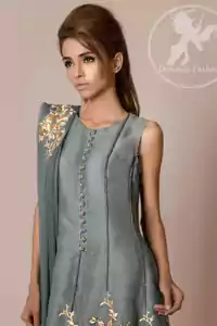 Grey short frock has been adorned with an embellished border on the hemline. Dangling beads have been implemented on the edges embroidered motif at the bottom of the trousers. Fixed waistband with side zip closure