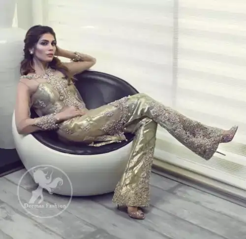 A straight short shirt with having Round neckline features beautiful embellishments on the neckline. Embellished border implemented at the bottom