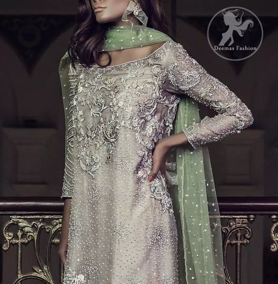 Features marvellous and awesome embellishments accent on the front. Full-length sheer Embellished sleeves and Concealed with back zip closure. Dupatta contains pearls and sequins sprayed all over.
