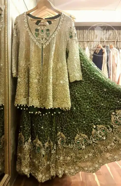 The front open short shirt features marvellous and awesome embellishments accent all over the front and sleeves. Embellished border implemented