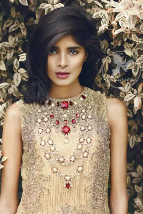 Beige and Golden Straight short shirt.has a large embroidered border implemented at the bottom of the shirt. We can add