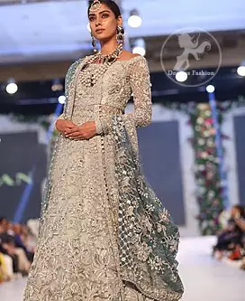 Silver Gray Bridal Frock. The frock features marvellous and awesome embellishments accenting all over the front and back Full-length sheer sleeves.
