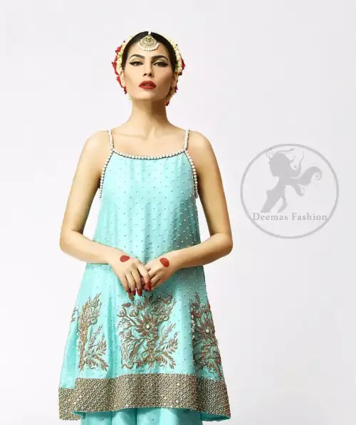 The frock has been adorned with a working border on the front and back hemline. Large embellished motifs are implemented