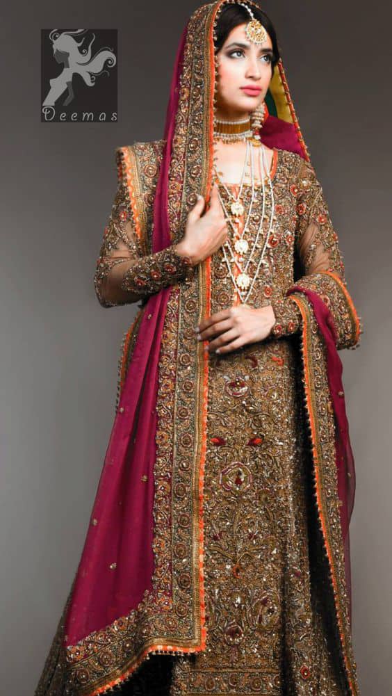 Dark brown heavily embellished back train maxi having rust piping with multiple colour embellishment on lehenga and pinkish red bridal dupatta having antique shades of embellishment all over the dress.