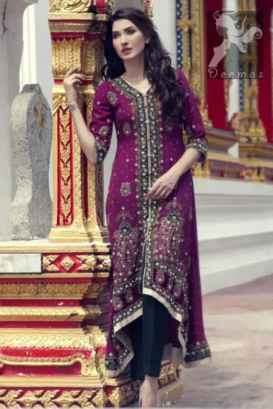 Dark purple front open back train gown. Gown having navy blue applique with silver embellishment. It comes with Navy blue churidar trousers and chiffon dupatta.
