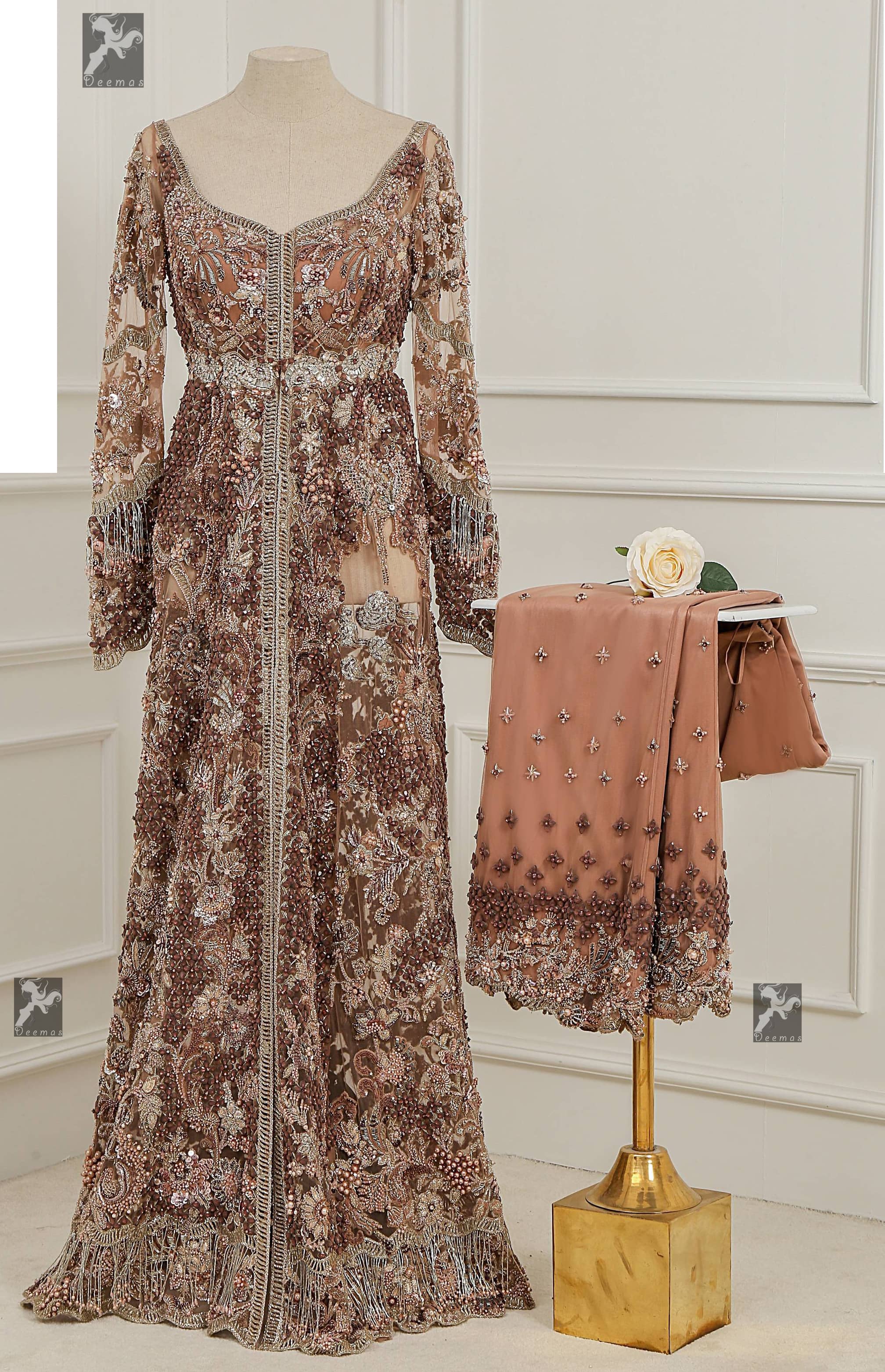 Light brown front open net maxi having brandy rose bodice. Maxi adorned with brown, light golden, champagne and silver embellishment. Pure organza dupatta adorned with embellished border.