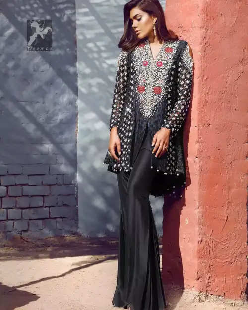 Black peplum made with pure banarsi jamawar chiffon. Peplum having multiple panels of different banarsi patterns. White and silver embellishment