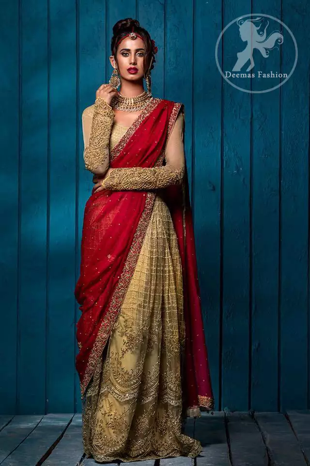 This outfit has antique brass pure banarsi jamawar blouse and embroidered net full sleeves. It comes with lehengha which embodies criss cross pattern all over it. It is further enhanced with floral borders around daman. Lehengha is scalloped and highlighted with tilla and silk thread embroidery (Resham). It is embellished with dull golden, antique shaded kora, dabka, tilla and sequins. This outfit is beautifully coordinated with scarlet embellished dupatta, decorated with four sided floral embroidery and spray of different sizes floral motifs and sequins all over it.