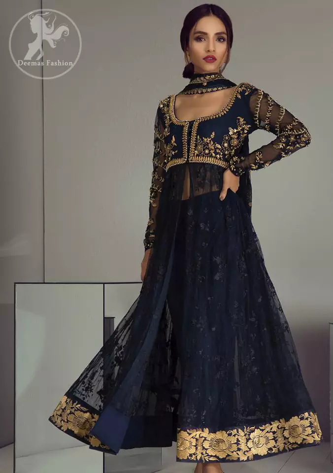 Look alluring in this floor length frock embellished with golden kora dabka, intricate embroidered motifs and detailed bodice. The border on the daman is enhanced with thread embellished floral pattern detailing that instantly draws attention. It comes with matching cigarette pants. It is paired up with dark blue dupatta with sequins sprinkled and finished with light embroidered edges.