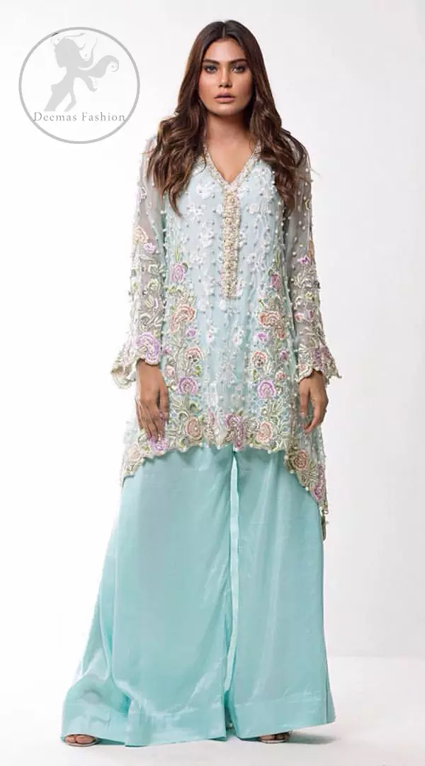 This self embroidered shirt embellished with floral thread embroidery. It is decorated with tilla, resham, kora, dabka, sequins and pearls. Daaman of the shirt is enhanced with scalloped border. It comes with sharara pants. It is beautifully coordinated with chiffon dupatta which is sprinkled with sequins all over it.
