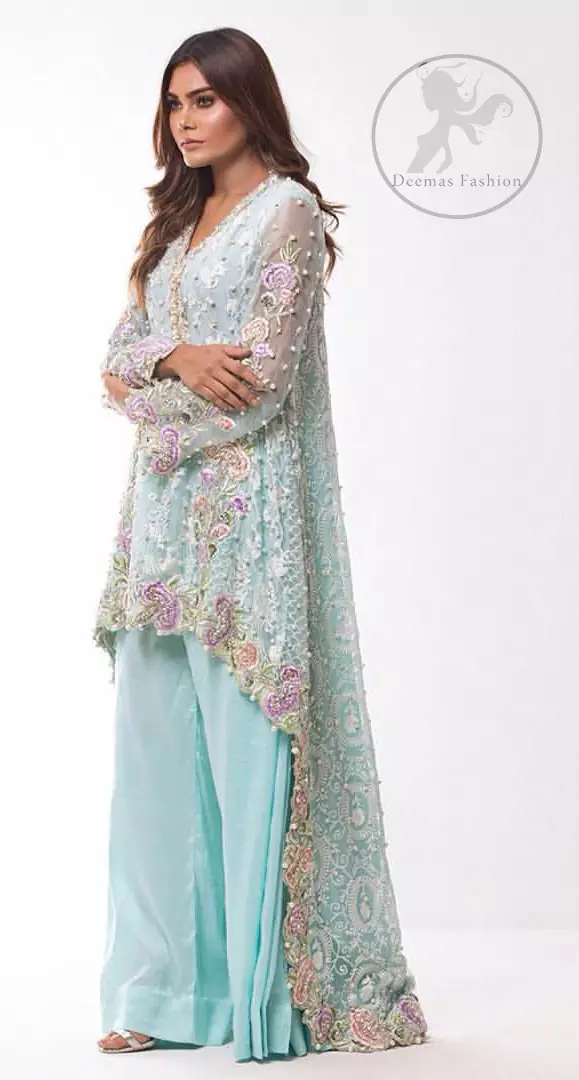 This self embroidered shirt embellished with floral thread embroidery. It is decorated with tilla, resham, kora, dabka, sequins and pearls. Daaman of the shirt is enhanced with scalloped border. It comes with sharara pants. It is beautifully coordinated with chiffon dupatta which is sprinkled with sequins all over it.
