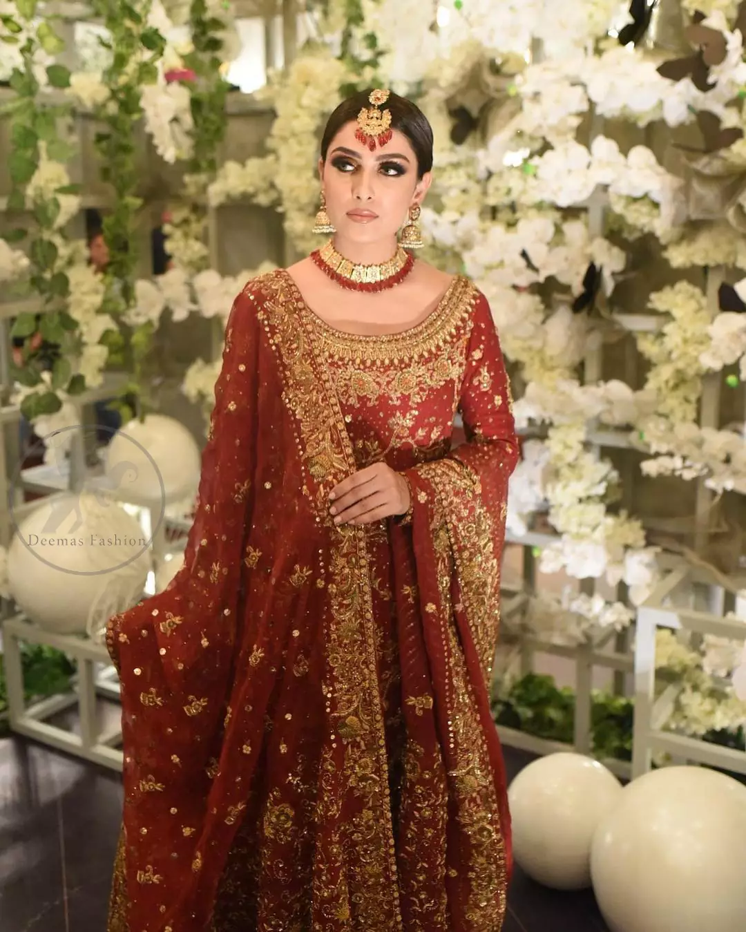 This dress is beautifully sculptured with floral embroidery. It is allured with red, dull golden, champagne and antique shaded kora dabka, tilla, sequins and pearls. It is adorned with beautiful U-shaped embellished neckline which adds to the look.It is artistically coordinated with rust embellished lehenga. It comes with burnt red dupatta which has heavy work on pallu and four sided embroidered border. Dupatta is sprinkled with small sized floral motifs all over.