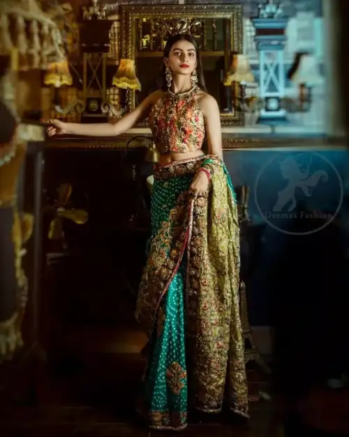This outfit is a timeless beauty. It is heavily embellished with antique gold kora, dabka, tilla, sequins and swarovski crystals.