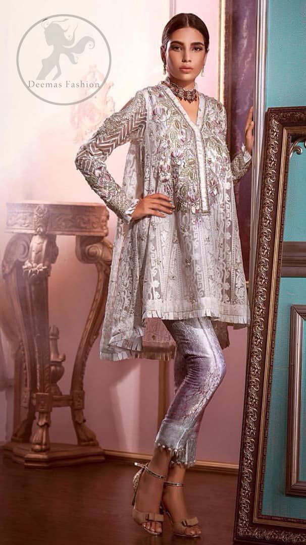 Reflecting exuberant color play in this ethereal piece meticulously highlighted with Swarovski, pearl and silver gold  kora dabka. The neckline is fully embellished with multiple color thread embroidery and floral motifs. Cold shoulder sleeves also decorated with silver gold kora dabka , tilla and thread embroidery. It comes with matching chiffon dupatta and pajama.
