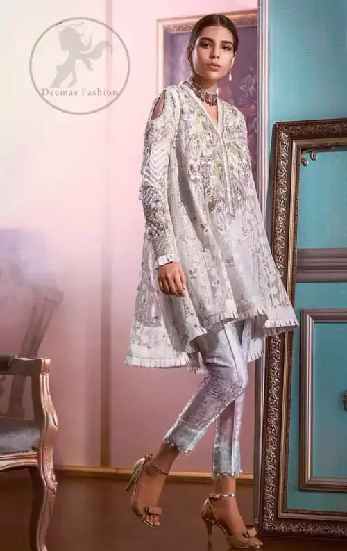 Reflecting exuberant color play in this ethereal piece meticulously highlighted with Swarovski, pearl and silver gold  kora dabka. The neckline