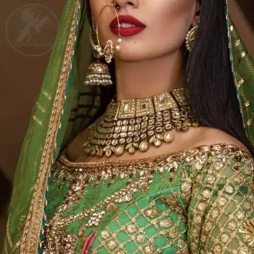 This outfit is embellished with gotta lace. It is meticulously highlighted with kora dabka, tilla, sequins and pearls. Sleeves are