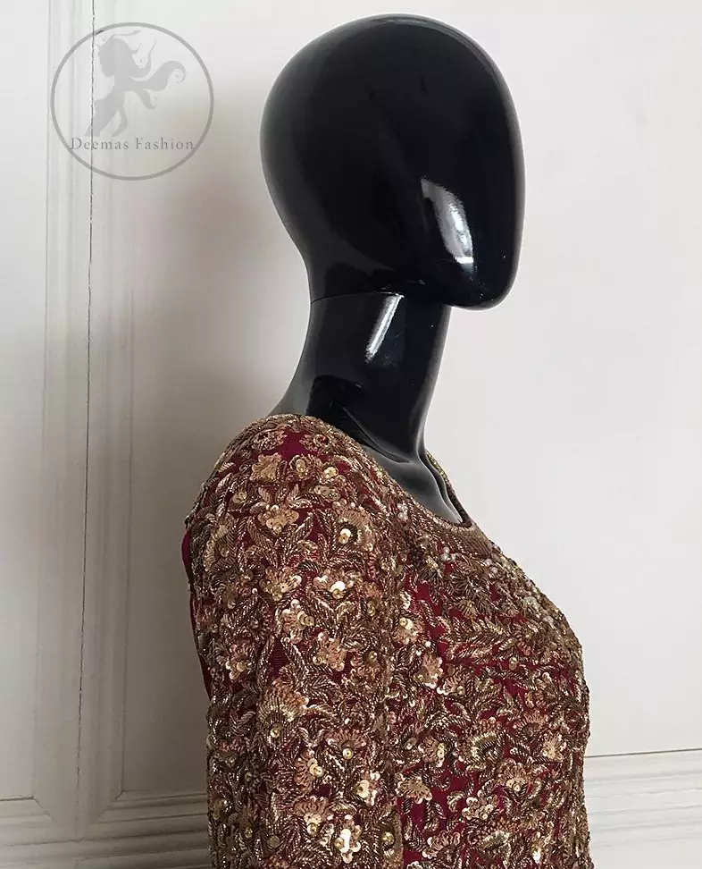 This outfit is meticulously highlighted with antique shaded kora dabka, tilla, sequins and swarovski. This dress is beautifully sculptured with floral embroidery. Shirt is fully embellished. It is artistically coordinated with embellished lehenga. Lehenga is enhanced with embroidered border and applique. It comes with chiffon dupatta, having four sided embellished border and sprinkled with sequins all over it.
