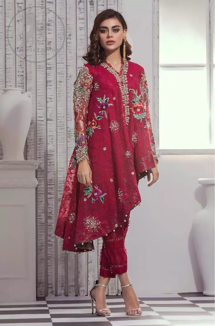 This outfit is embellished with resham thread. It is meticulously highlighted with kora dabka tilla sequins and pearls. Sleeves are adorned with floral embroidery. V-shaped neckline adds to the look. Hemline is allured with beautiful tassels. It comes with shocking pink pants pajama.It is coordinated with chiffon dupatta which is sprinkled with sequins all over.