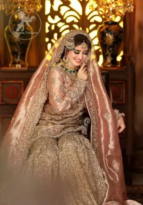 Feel glamorous in antique brass short shirt with fascinating embellishment on neckline with golden kora dabka, tilla and pearls. Floral