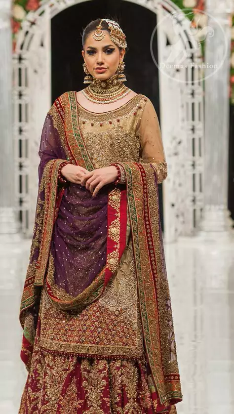 This bridal dress is perfect for your special day. Exude elegance in this chiffon shirt finessed with beautiful embellished daman and neckline, done with antique shaded kora dabka, tilla, sequins and pearls. Lehenga comprises of floral embroidery adorned with thick embellished border. It comes with purple dupatta with embroidered borders on all sides and sequins spray on the ground.