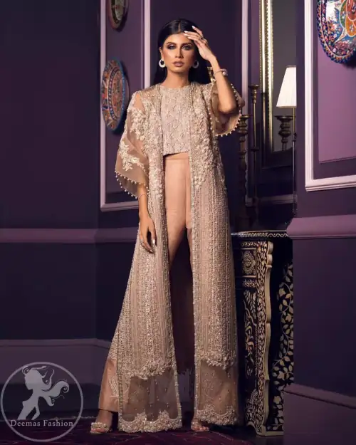 This dress is decorated with floral embroidery. It is highlighted with kora, dabka, tilla, sequins and pearls. Gown is adorned