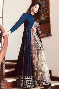 Look alluring in this floor length frock embellished with kora, dabka, tilla, sequins and pearls. The border on the daman is enhanced with embellished floral pattern, detailing that instantly draws attention. It comes with matching cigarette pants. Multiple panels adds to the look. It is paired up with embroidered shawl with sequins sprinkled and finished with light embroidered edges.