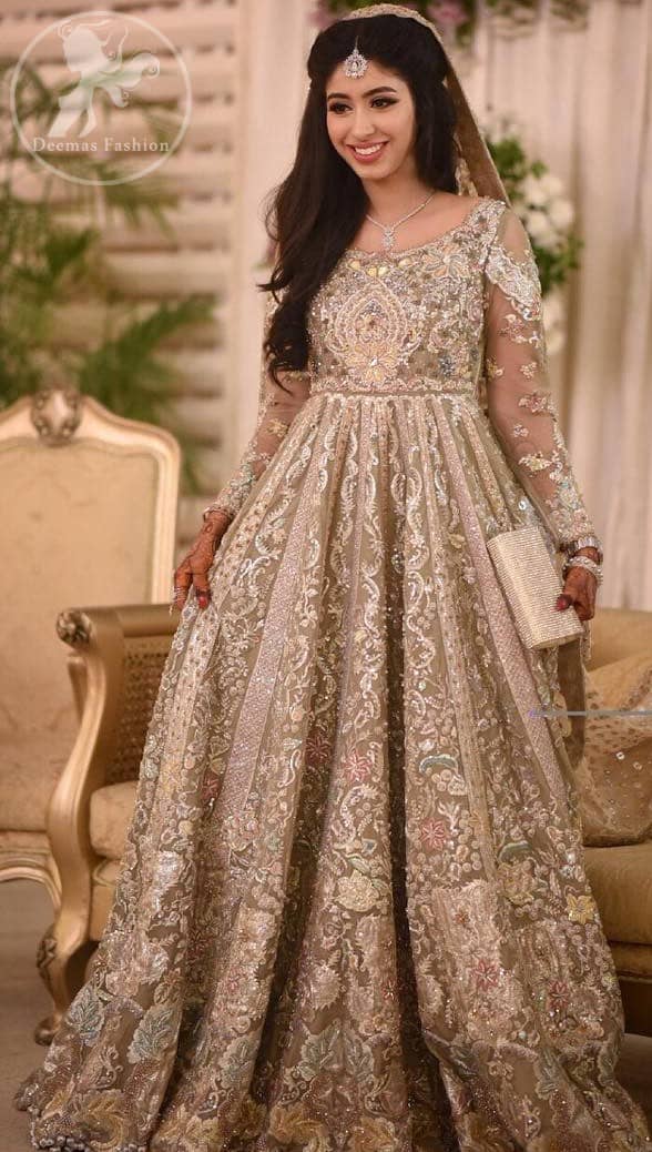 This outfit is a timeless beauty. Feel glamorous in our multiple paneled maxi with fascinating embellishment on neckline with silver kora dabka, pearl and sequins. Sleeves are decorated in victorial styles embroidery. It comes with brocade trouser. It is coordinated with tissue dupatta which is sprinkled with sequins all over it. It is further furnished with four sided embellished border.