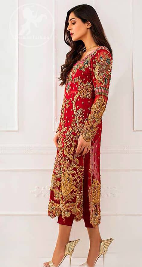 This dress is beautifully sculptured with floral embroidey, adorned with cutwork borders, colorful embellishments and zerdozi work. The detailed scalloped border gives a perect ending to this shirt. Having full length sleeves and small sprinkled motifs on ground. Paired up with red capri pants and comprises with red dupatta.