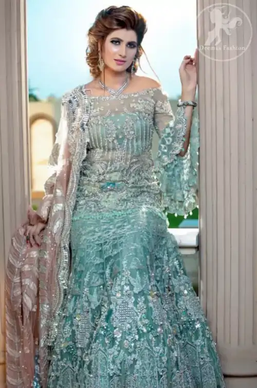 Boost your confidence and style in this glamorous off-shoulder short shirt in net fabric which is extensively worked in sequins