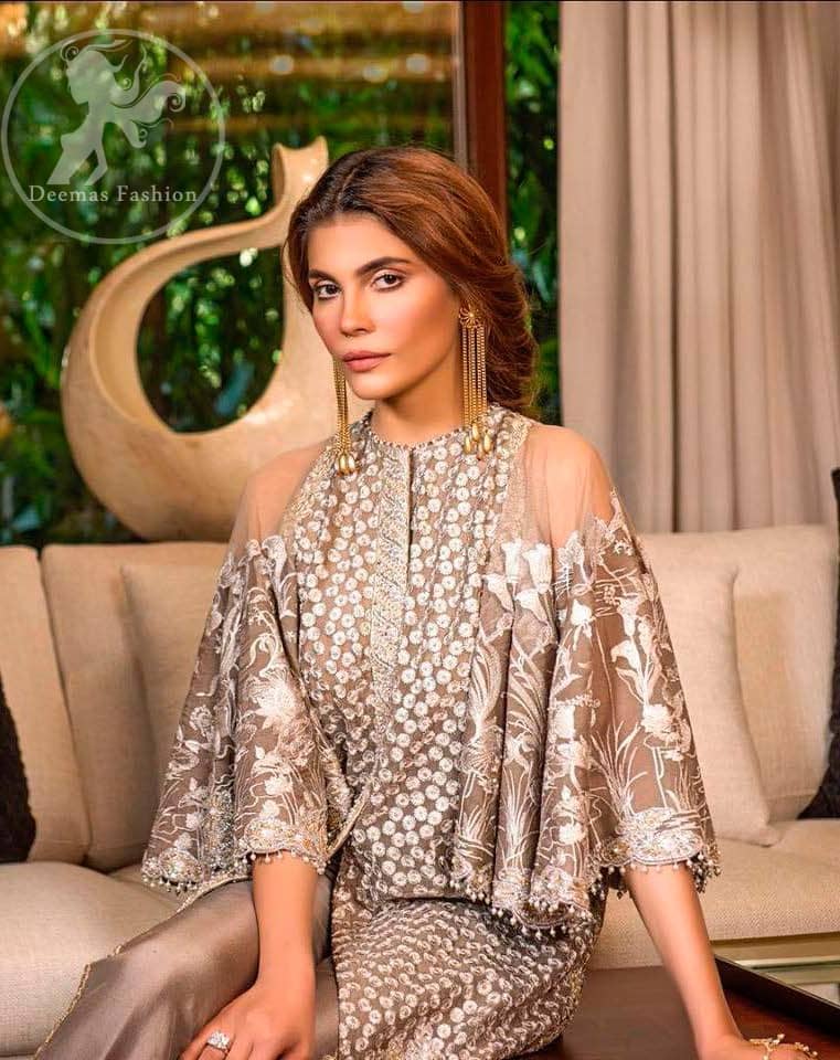 This dress is beautifully decorated with heavy embroidery. It is highlighted with dull golden kora, dabka, tilla, sequins and pearls. Fish lehengha is fully embellished.Blouse is scalloped. It comes with beautifull upper gown, sprinkled with sequins all over it. It is coordinated with chiffon dupatta which is sprinkled with sequins all over it.