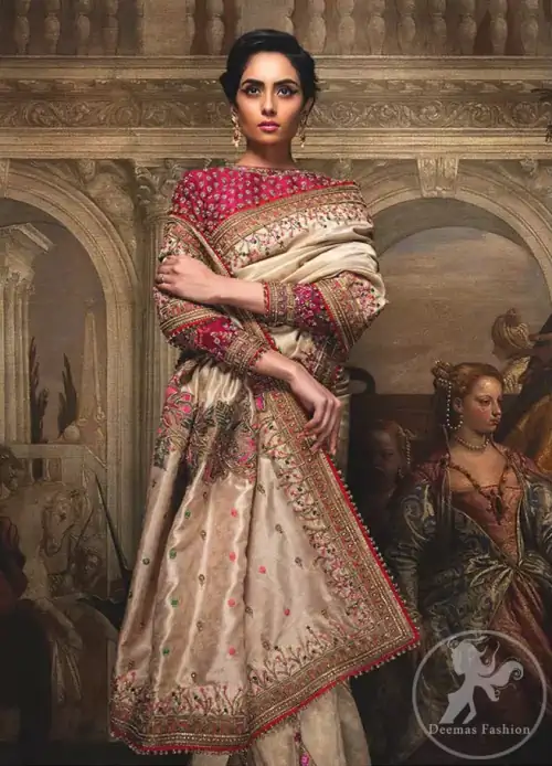 This dress is beautifully sculptured with floral embroidery. It comes with fully embroidered brocade blouse which adds to the look.