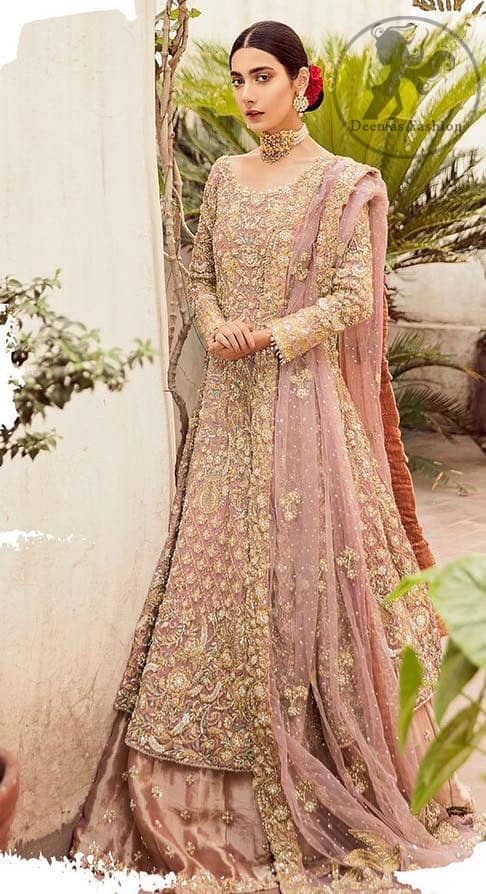 The grand gold bridal stands out due to its uniqueness and the perfect fusion of modern cut and traditional embroidery. It is highlighted with dull golden and silver kora, dabka, tilla, sequins and pearls. The frock is fully embellished from daman. It is coordinated with matching lehenga which has sprinkled floral motifs. This outfit is paired up with net dupatta which is sprinkled with sequins and small floral motifs. It is furthermore enhanced with four sided scalloped border.