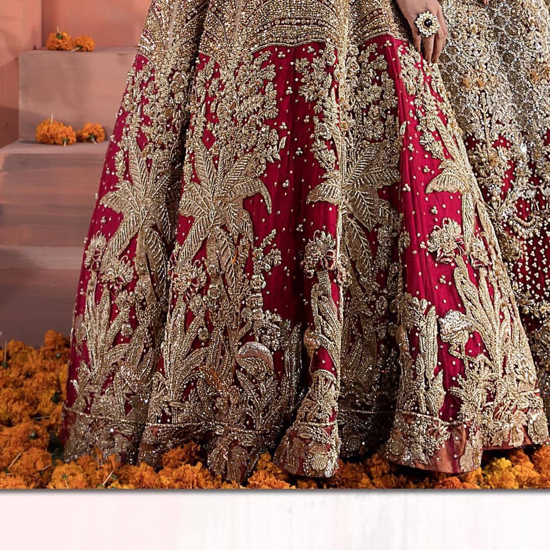 The bridal stands out due to its uniqueness and the perfect fusion of modern cut and traditional embroidery. This dress is beautifully decorated with heavy embroidery. It is highlighted with kora, dabka, tilla, sequins and pearls. It comes with embroidered sharara. It is coordinated with tissue dupatta which is sprinkled with sequins all over it. It is further furnished with four sided scalloped border.