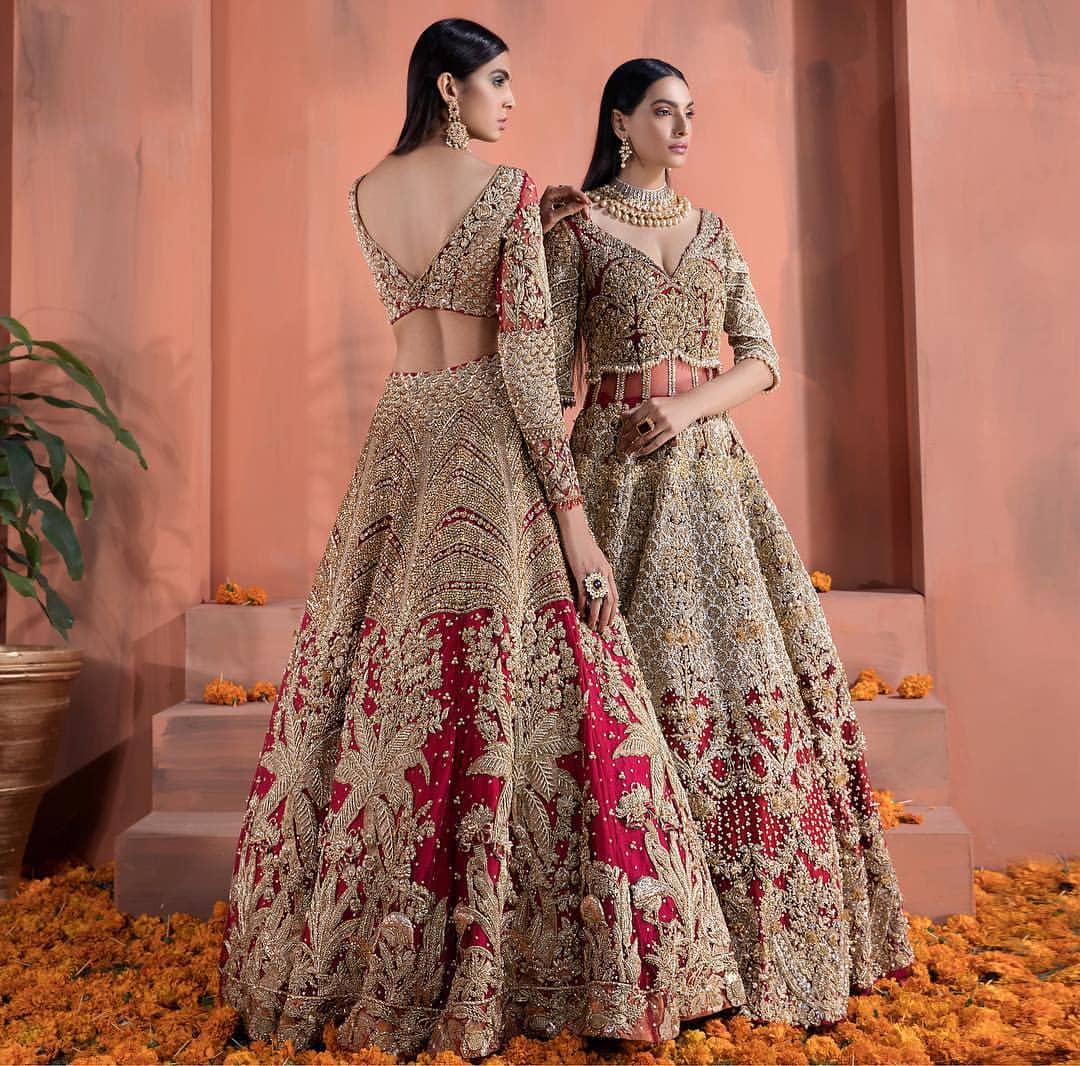 The bridal stands out due to its uniqueness and the perfect fusion of modern cut and traditional embroidery. This dress is beautifully decorated with heavy embroidery. It is highlighted with kora, dabka, tilla, sequins and pearls. It comes with embroidered sharara. It is coordinated with tissue dupatta which is sprinkled with sequins all over it. It is further furnished with four sided scalloped border.