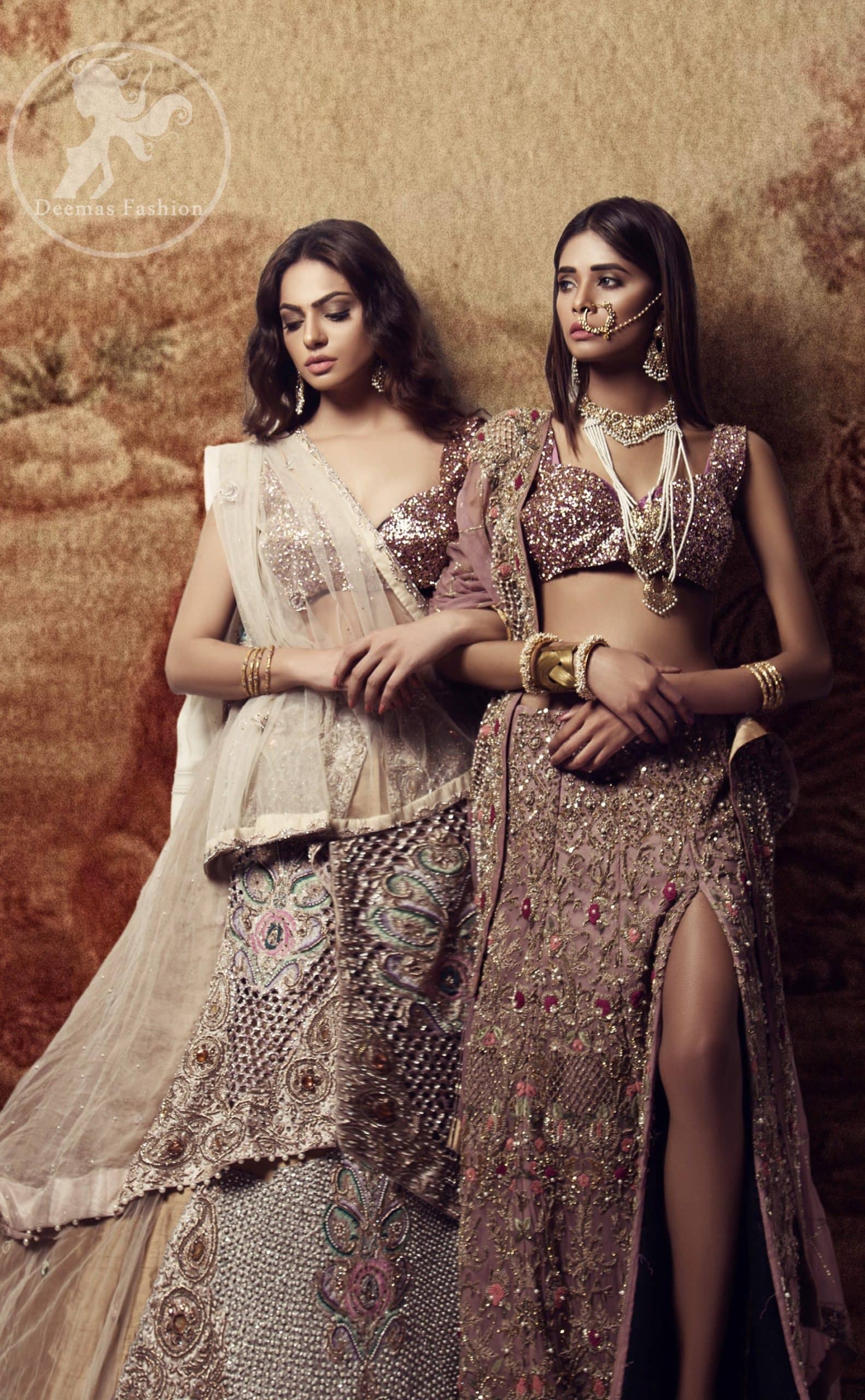 The bridal stands out due to its uniqueness and the perfect fusion of modern cut and traditional embroidery. This dress is beautifully decorated with heavy embroidery. It is highlighted with kora, dabka, tilla, sequins and pearls. It comes with embroidered sharara. It is coordinated with tissue dupatta which is sprinkled with sequins all over it. It is further furnished with four sided scalloped border.