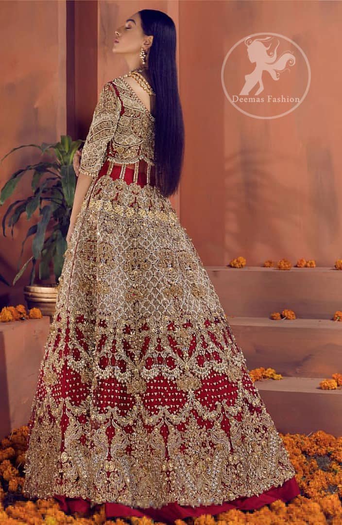 Reflecting royalty and the majestic beauty of statuesque shape and silhouette this bridal dress is perfect for your special day. This traditional outfit is aesthetically designed with motifs and floral patterns, embellished with kora, dabka, nakshi, sequins, crystals and stones. The back of the maxi also adorned with floral motifs in kora, dabka with sequin spray all over. It comes with brocade pajama. It is paired with heavily embroidered organza dupatta that gives the right amount of glamour to the outfit.