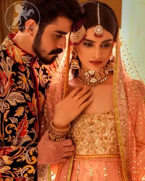 A handful of stardust on a contemporary dress, crafted delicately with dainty floral embroidery and gotta work embroidery. It is