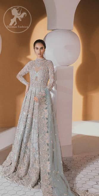 Take a step towards refreshing your wardrobe with this outfit. The frock is perfected with delicate golden and silver embroidery. Furthermore this shirt is made of rich floral embroidery which is enhanced with zardoze work. It is highlighted with kora, dabka, tilla, sequins and pearls. It comes with brocade churidar pajama. It is coordinated with tissue dupatta which is sprinkled with sequins all over it. It is further furnished with four sided matha patti style embellished border.