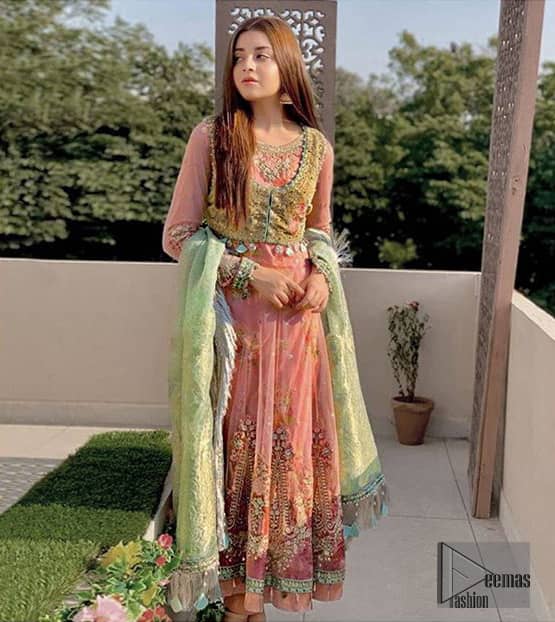 This pishwas is the perfect combination of tradition and class for mehndi mayon function or nikah day. Wear this soft and supple hues richly decorated by shades of golden and whites with thread embroidered motifs and floral bunches at daaman. The bottom of the pishwas is enhanced with lace finishing and tassels. Style it up with fully embellished velvet jacket. It comprises with churidar pajama. This nikah dress is coordinated with brocade dupatta having lace border on all four sides.