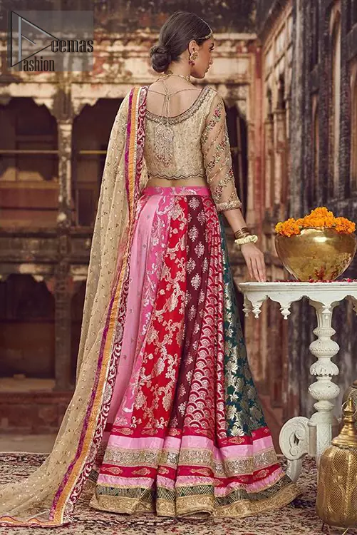 Make your special day more interesting with this shabby chic statement intensified with rich thread and tilla work all over the front, a large motif in the center and bold patterns at the end of blouse. Having full length sleeves adorned with floral bootis. Add some super cool twist to your look with these subtle colors in this lehenga enhanced with different color panaels. The bottom of the lehenga is adorned with applique and laces. Style it up with golden dupatta adorned with four sided applique border and scattered sequins all over.
