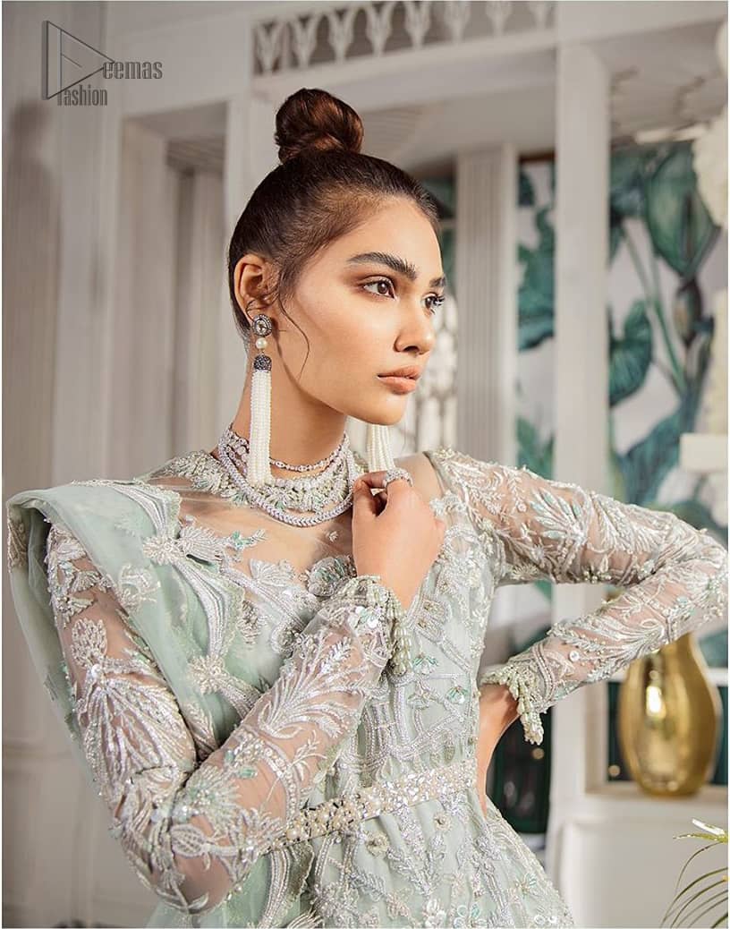 Delicately crafted and personifying chic elegance with an element of grandiose. This outfit is aesthetically designed with motifs and floral patterns, embellished with kora, dabka, nakshi, sequins, cutdana and crystals. The detailed scalp border gives a perfect ending to this peplum. Beautifully designed sleeves is an amalgamation of floral design elements. Sharara comprises of sequins spray all over. The dupatta incorporates beautifully designed scalloped borders on all four sides and tiny floral motifs.