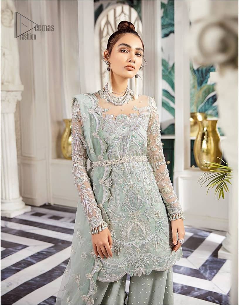Delicately crafted and personifying chic elegance with an element of grandiose. This outfit is aesthetically designed with motifs and floral patterns, embellished with kora, dabka, nakshi, sequins, cutdana and crystals. The detailed scalp border gives a perfect ending to this peplum. Beautifully designed sleeves is an amalgamation of floral design elements. Sharara comprises of sequins spray all over. The dupatta incorporates beautifully designed scalloped borders on all four sides and tiny floral motifs.