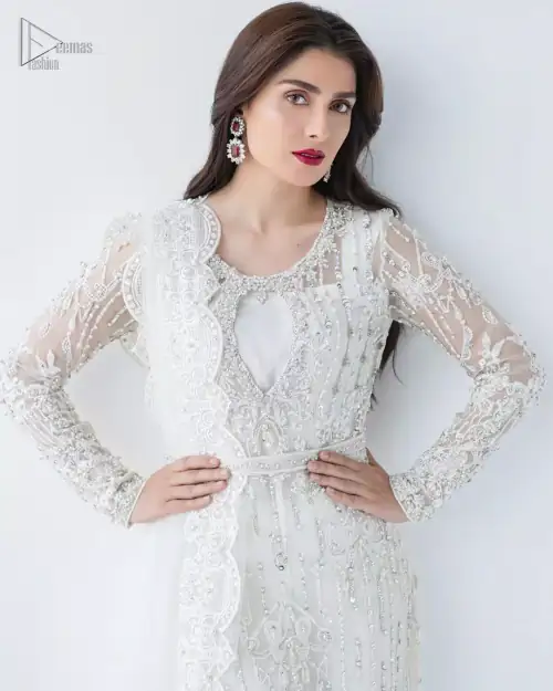 This is an ensemble that deserves to be flaunted. The ivory white shirt is an example of remarkable handiwork. With