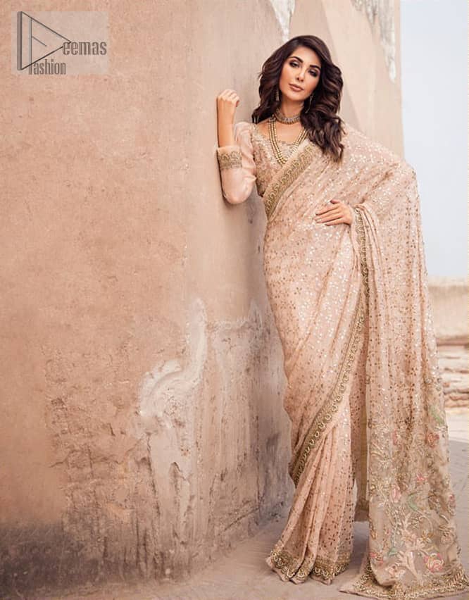 Steal the show with this endearing chiffon saree with intricate yet rich mukesh details. Crafted artfully with detailed thread embroidery on saree pallu and traditional neckline finessed with kora, dabka and kundan. Having full sleeves with mukesh details and zardosi finishing. Furthermore it is adorned from all sides with antique shaded kora, dabka, tilla and sequins.