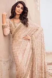 Steal the show with this endearing chiffon saree with intricate yet rich mukesh details. Crafted artfully with detailed thread embroidery on saree pallu and traditional neckline finessed with kora, dabka and kundan. Having full sleeves with mukesh details and zardosi finishing. Furthermore it is adorned from all sides with antique shaded kora, dabka, tilla and sequins.