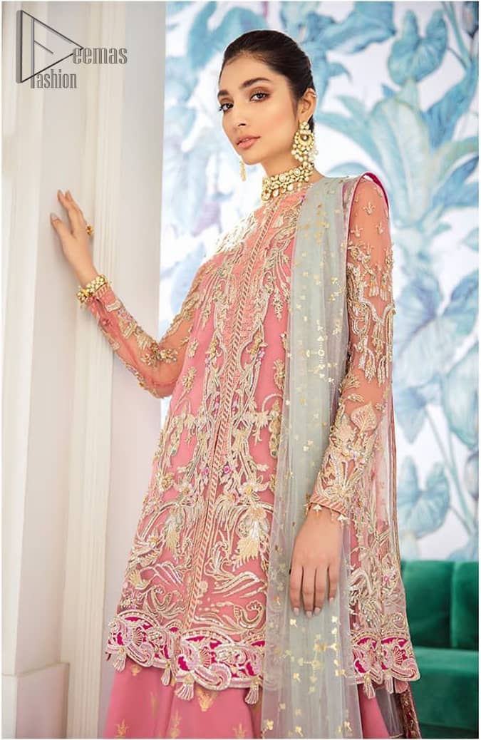 Let the crowd stare and make it worth their while when you walk wearing this outfit. A perfect ensemble for this festive season with divine detailing of thread embroidery, color balance and well-crafted applique hemline. The front open frock is fully embellished with floral embroidery done with light golden zardozi work and thread embroidery. It comprises with pink self fabric sharara and mint green dupatta, adorned with sequins spray on the ground and embellished pink applique pallu. You would definitely want to wear this for your next occasion.