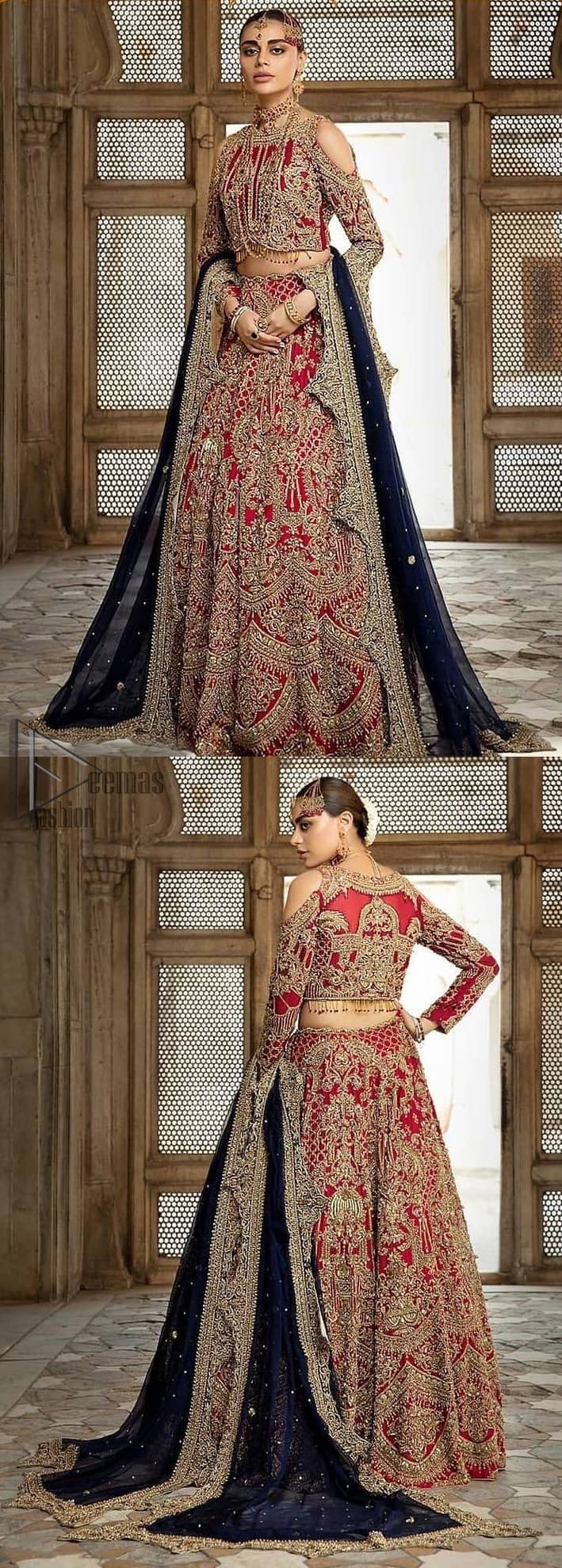 A breathtaking red traditional lehenga paired with a detailed blouse, equally alluring make for an ensemble which is comfortably chic. The blouse is done with golden and antique shaded embroidery and finishing with tassels. Blouse having cold shoulder full sleeves. The lehenga is enhancing with the art of classical heritage showcasing the craftsmanship of kora, dabka, tilla, kundan and sequins detailed, artistically embellished to give a beautiful rhythm to the outfit. It comprises with navy blue dupatta sprinkled with sequins and four sided scalloped border. This is an ensemble that is sure to invite compliments galore.