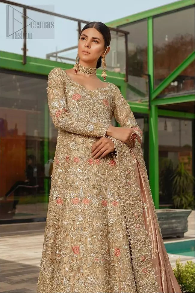 Nothing speaks of femininity and class louder than this outfits for bridesmaids. It is highlighted with golden and silver kora, dabka, tilla, sequins and pearls. The maxi is heavily ornamented with floral jaal done with zarozi work and floral motifs are decorated with peach and ivory thread embroidery. It comes with fawn lehenga adorned with scalloped embroidered bottom. Furthermore, lehenga is enhanced with peach frilled bottom. It is coordinated with peach dupatta which is sprinkled with sequins all over it. It is further furnished with four sided thick border.